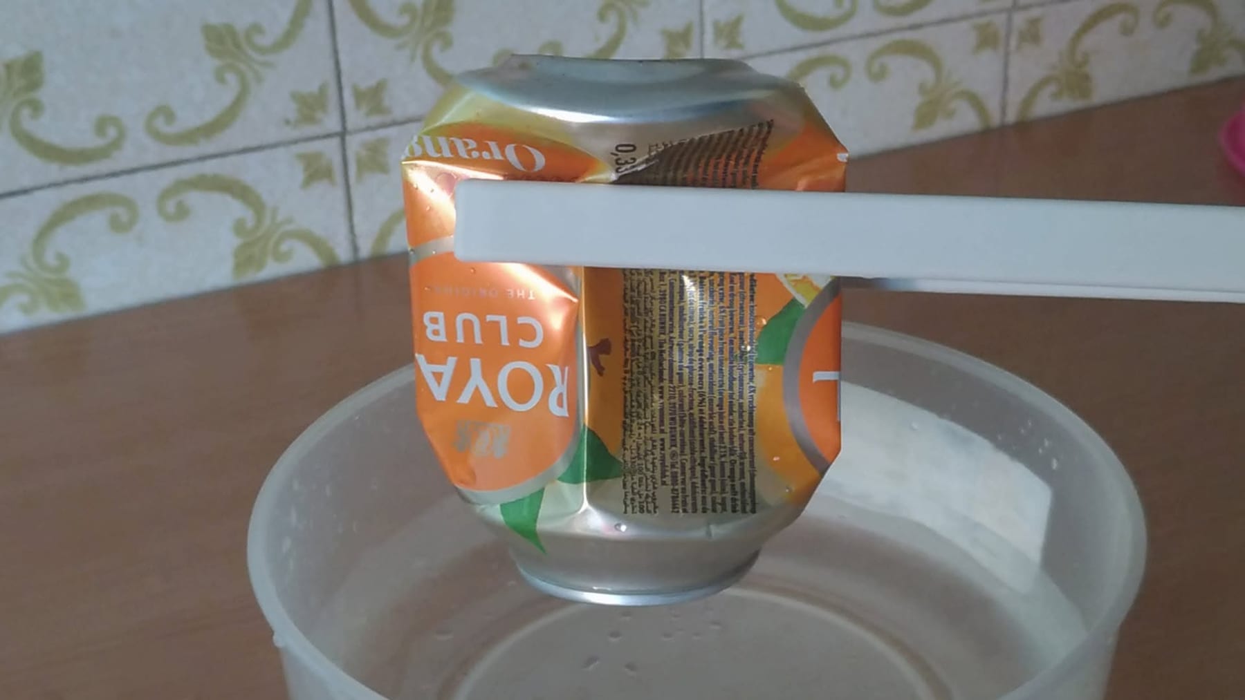 A soda can crushed flat by air pressure in the can crush experiment